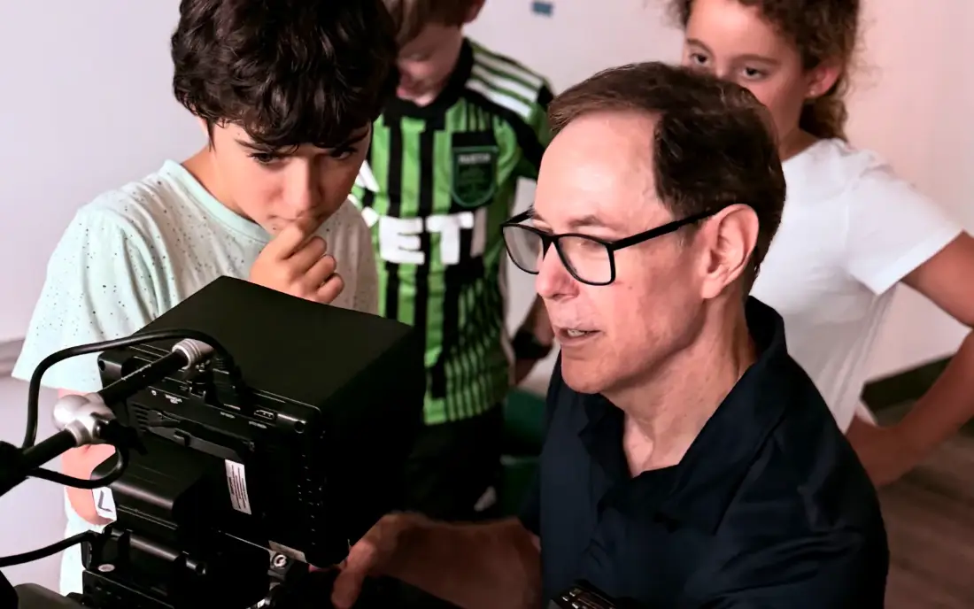 Filmmaking camp for kids ages 7–12 — young campers on set with a real camera